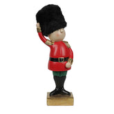 Soldatino natalizio in resina con mano alzata e cappello in peluche nero H25 cm