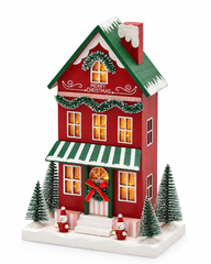 Diorama Casetta Natalizia LED in legno H 27,5 cm EDG Enzo De Gasperi Exclusive, casa rossa con tetto verde innevato, finestre illuminate e abeti natalizi.
